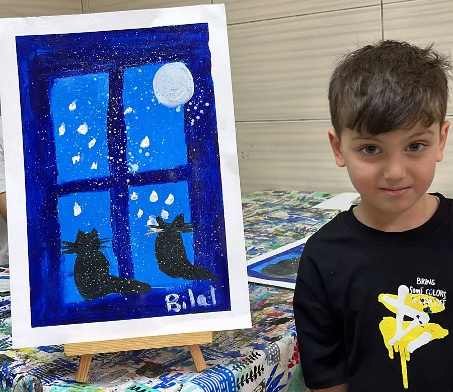 Bilal infront of his painting